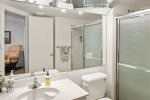 The en-suite bathroom has a single vanity and a shower